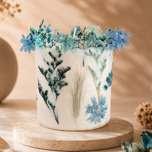 Blue botanical soy wax candle with real dried flowers, handmade by Isola Aura Home in Belgium