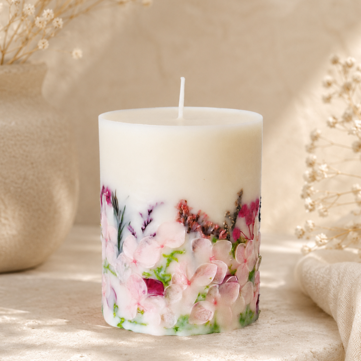 Blush botanical soy wax candle with real dried flowers, handmade by Isola Aura Home in Belgium