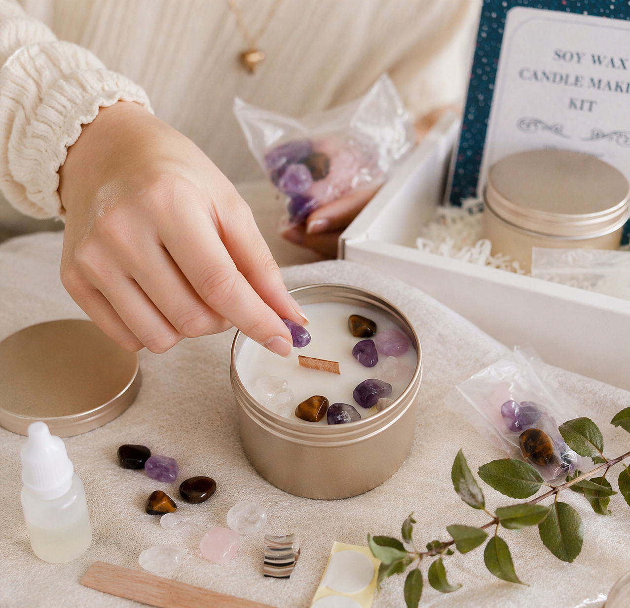 Decorating a handmade soy wax candle with crystals using a DIY crystal candle making kit