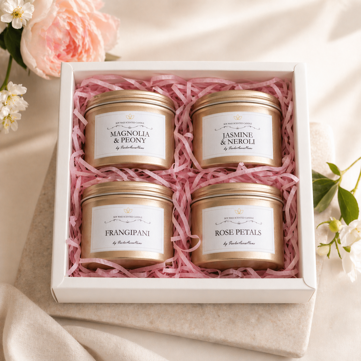 Floral soy candle gift box with four mini scented candles in a white box, handmade by Isola Aura Home in Belgium