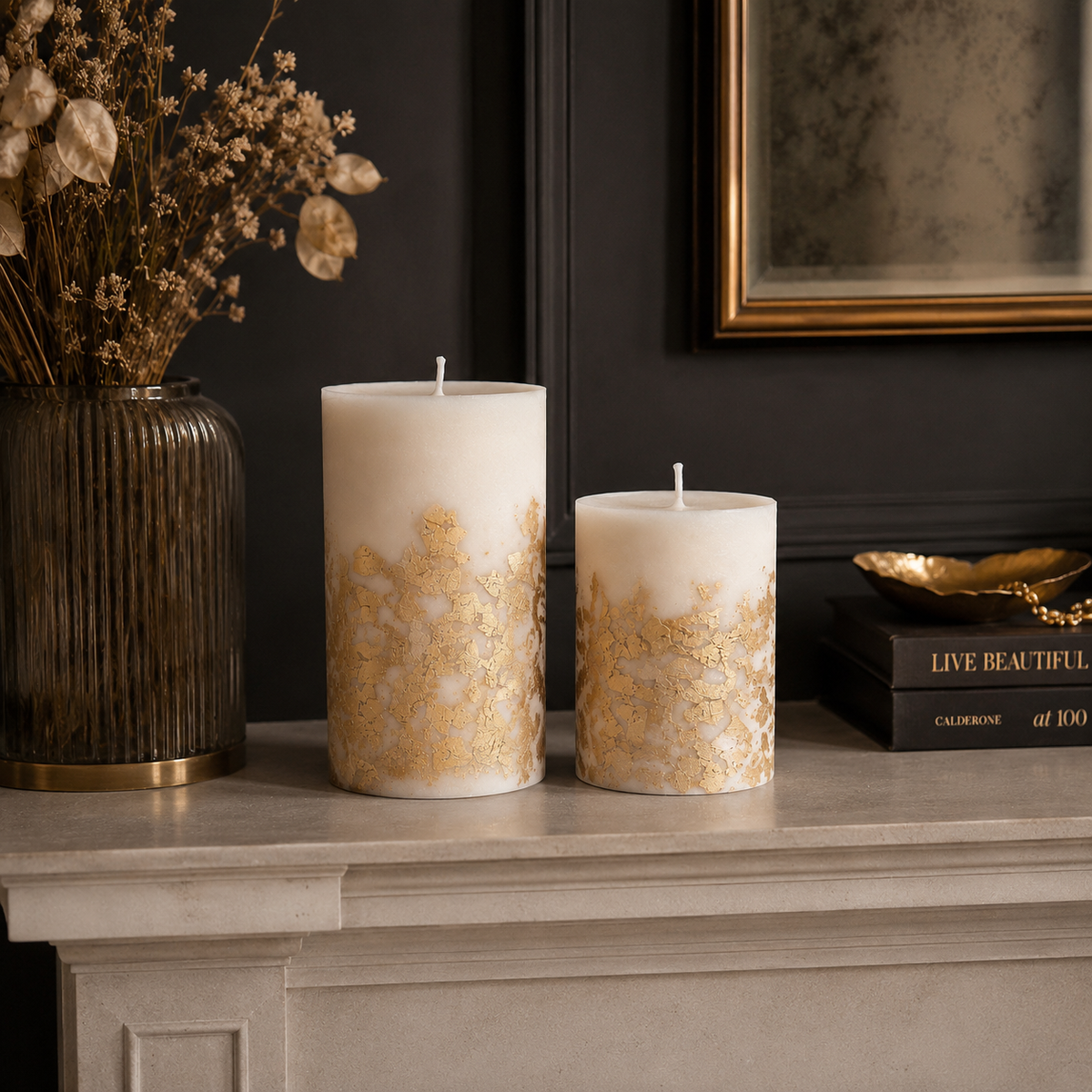 Gold leaf soy pillar candles in two sizes styled as sophisticated mantelpiece decor