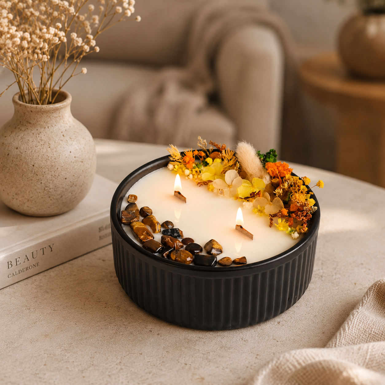 Lit Golden Bloom and Tiger’s Eye floral crystal candle with wooden wicks and dried flowers