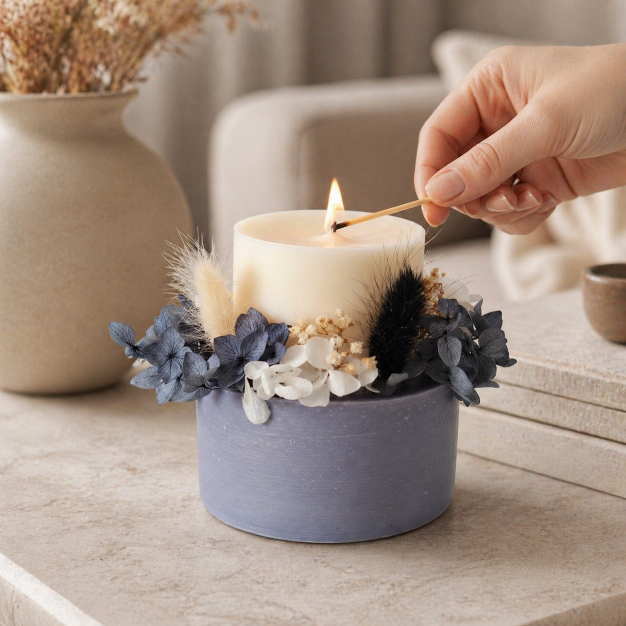 Midnight grey botanical soy wax candle lit in a warm elegant setting