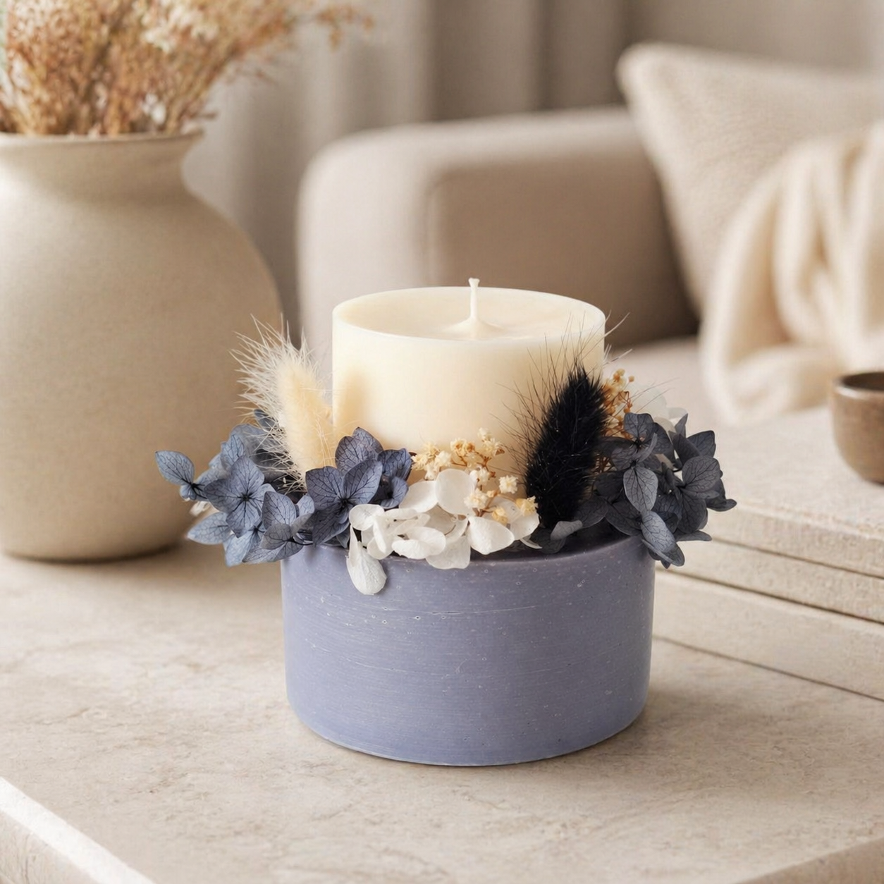 Midnight grey signature botanical candle styled in an elegant neutral home interior