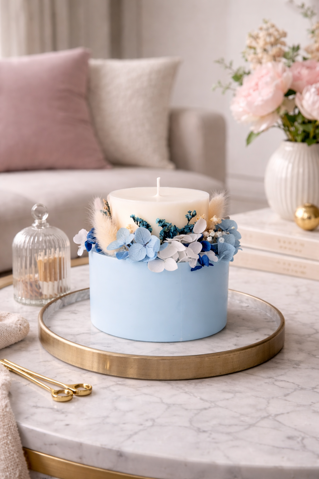 Powder blue signature floral candle styled in a soft elegant home interior