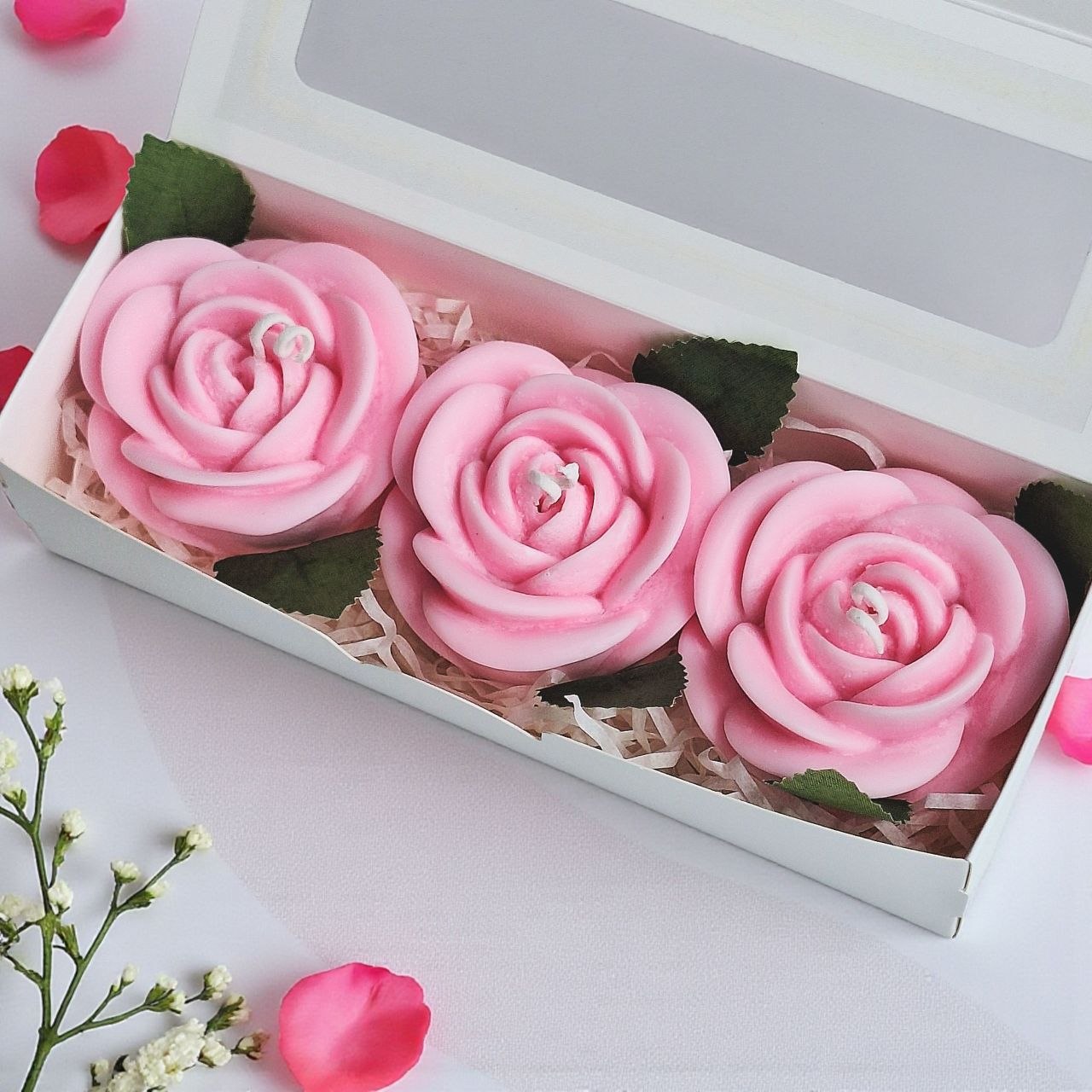 Rose candle gift box with three pink soy wax rose candles in a white window box
