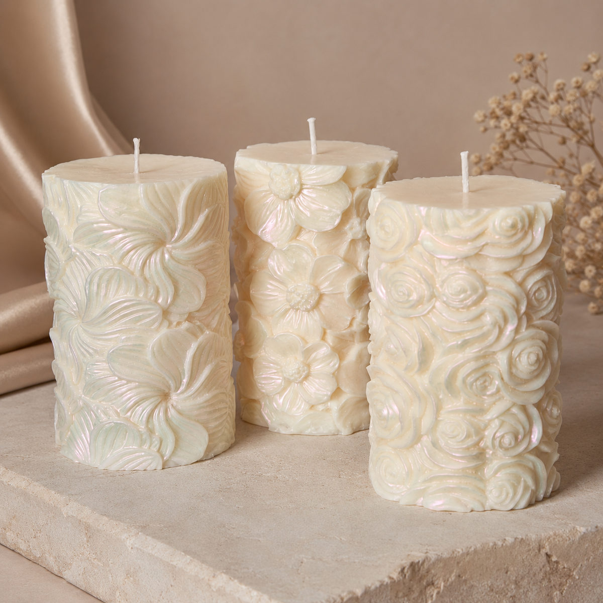 Ivory sculptural soy pillar candles with Tropical Bloom, Wildflower Meadow and Rose Garden floral patterns.