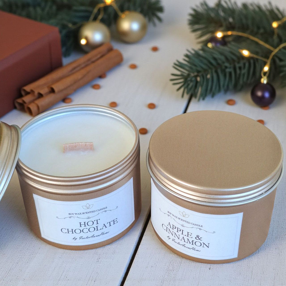 Open soy candles with wooden wicks in gold tins from a Christmas gift set