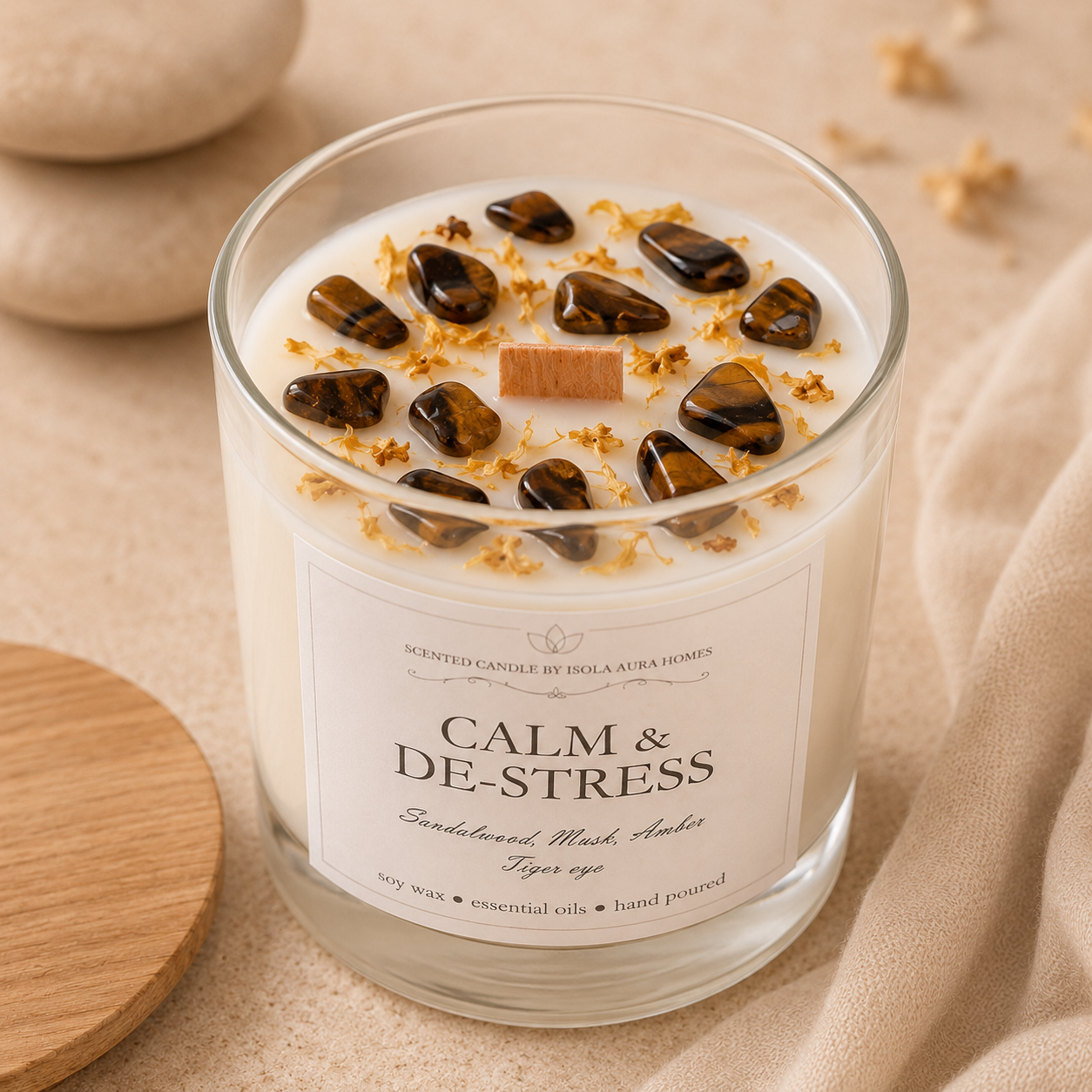 Close-up of a soy wax candle decorated with genuine tiger’s eye stones and botanical details